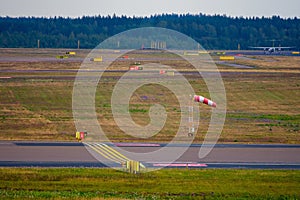 Towers and runways of the airport surrounded by trees