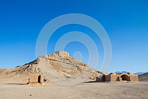 Towers of Silence in Yazd, Iran, in the middle of the desert. Also known as Dakhma, These towers were used in Zoroastrian religion