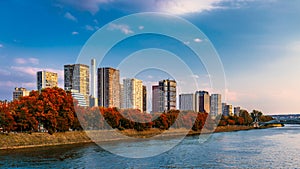 Towers and skyscrapers in Paris, France, used as office buildings as well as office buildings, by the water in front of barges on