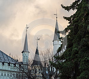 Towers of he Small Guild and the Great Guild in the Old Town of Riga under dramatic evening clouds
