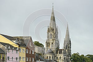 Towers of st Finbar\'s cathedral and rooftops of the surrounding buildings of the city of Cork