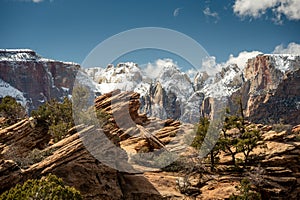 Towers Of The Virgin Blanketed In Snow With Rocks At Canyon Overlook In Zion