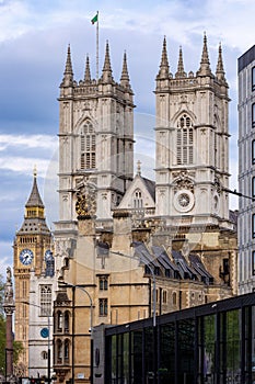 Towers of Westminster Abbey with Big Ben at background, London, UK