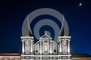 Towers of the white St. Paul church in Zilina at night, Slovakia