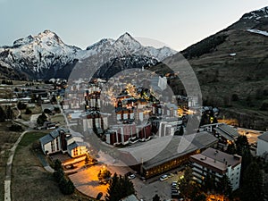 Town in the alps mountains during sunset.Aerial drone photo Blue Hour French alps in winter, Rhone Alpes in France Europe. Les