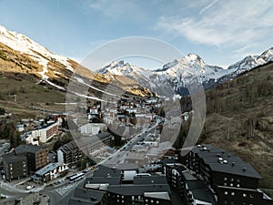 Town in the alps mountains during sunset. Aerial drone photo. French alps in winter, Rhone Alpes in France Europe . Les deux