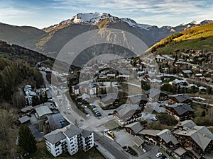 Town in the alps mountains during sunset. Aerial drone photo. French alps in winter, Rhone Alpes in France Europe . Les deux