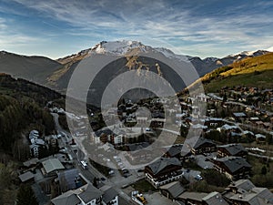 Town in the alps mountains during sunset. Aerial drone photo. French alps in winter, Rhone Alpes in France Europe . Les deux