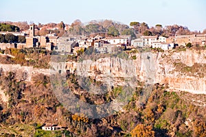 The town of bagnoregio over calanchi valley photo