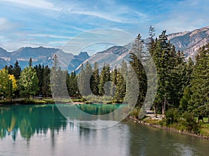 Town of Banff, Bow River Trail scenery in summer sunny day. Banff National Park, Canadian Rockies, Alberta, Canada. Mount Rundle