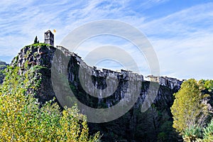 Town of Castellfollit de la Roca settled on a basaltic cliff in Girona, Catalonia photo