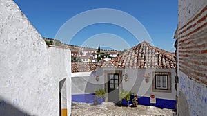 Portugese white houses in fortified medieval town Obidos in Portugal photo