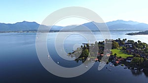 Town at Chiemsee lake seen from an aerial drone view
