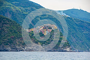 The town of Corniglia, one of the five small towns in the Cinque Terre national Park, Italy. View from the excursion ship.