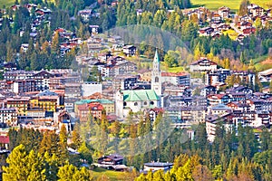 Town of Cortina d` Ampezzo in green landscape of Dolomites Alps photo
