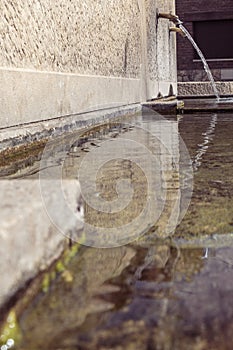 town fountain with spout water falling