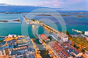 Town of Grado archipelago and bridge to mainland aerial evening view