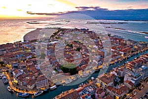Town of Grado colorful architecture and archipelago aerial evening view photo