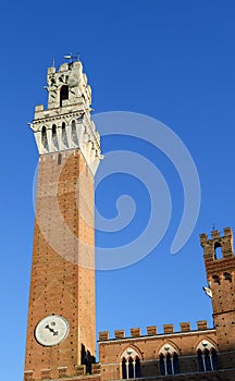 Town Hall called PALAZZO PUBBLICO and Tower in Siena In itay