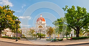 Town hall of Cienfuegos city at Jose Marti park with some locals