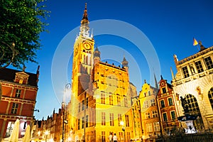 Town Hall and Neptune`s Fountain at Dlugi Targ Long Market street at night in Gdansk, Poland