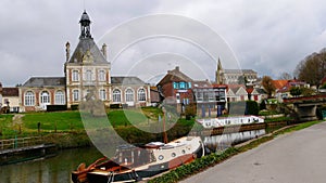 Town hall and Saint Jean-Baptiste neogothic catholic church in the village of Long