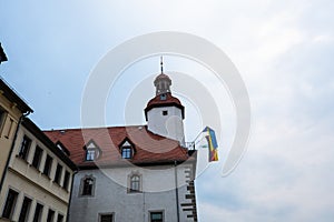 Town hall of SchmÃÂ¶llin in Thuringia, with flag of Ukraine