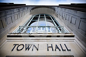 Town hall sign at local government office with balcony