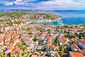 Town of Jelsa bay and waterfront aerial view