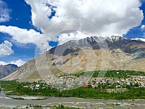 Town of Kargil nestled below a mountain photo