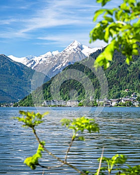 Town and lake of Zell am See in front of the impressive snow-capped Kitzsteinhorn, Zell am See, Pinzgau, Salzburger Land, Austria photo