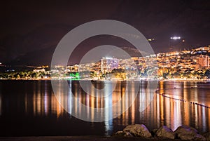 Town Makarska with Biokovo mountains in the background at night, Croatia