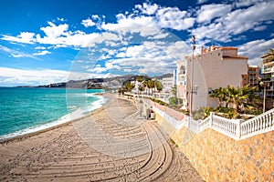Town of Nerja turquoise sand beach view photo