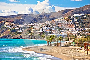 Town of Nerja turquoise sand beach view photo