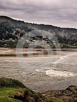 Town nestled between the mountains and ocean.