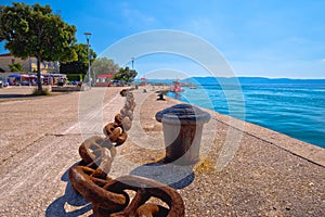 Town of Njivice Riva ship iron chain aand waterfront view