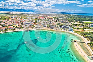 Town of Novalja beach and waterfront on Pag island aerial view