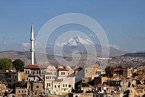 The town of Ortahisar in Cappadocia with Mount Erciyes in the background