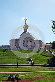The Town Of Peterhof. Russia. The building of the Museum `Special storeroom` with a gilded dome and The Russian Royal coat of arms