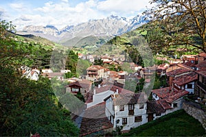 The town of Potes at a sunny morning on a background of mountains, Cantabria, Spain photo