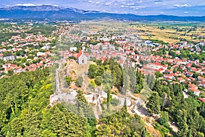 Town of Sinj in Dalmatia hinterland view, historic fortress and church on the hill photo