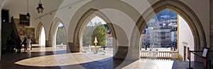 Town of Sintra seen through the gothic arches of the entrance of Palacio Nacional de Sintra or Sintra National Palace aka Palacio photo