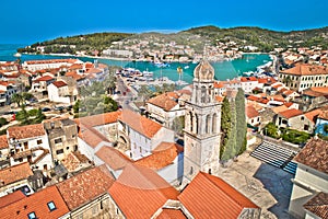 Town of Vela Luka on Korcula island church tower and coastline aerial view