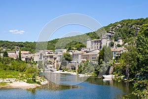 The town of Vogue in the middle of the Ardeche gorges in Europe, France, Ardeche, in summer, on a sunny day