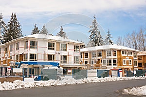 Townhome complex under construction in snow