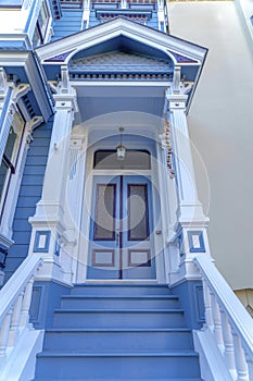 Townhome entrance exterior with victorian style trims at San Francisco, California