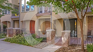 A townhome with fences porches and balconies photo