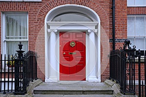 townhouse with bright red door