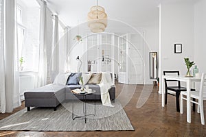 Townhouse interior with rattan lampshade