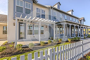 Townhouse with yard and white fence in Daybreak